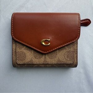 Coach Wyn Small Wallet Colorblock Signature Canvas Brass Tan Rust Trifold